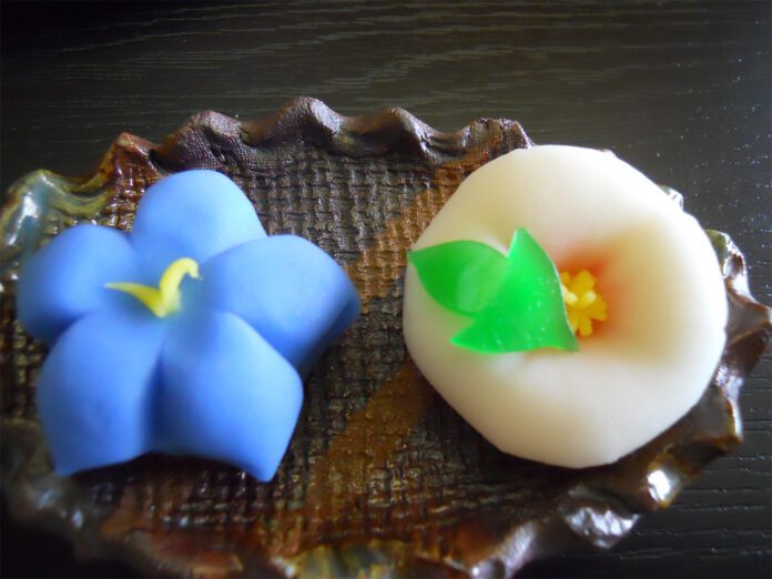 Handmade bellflower and Rose of Sharon wagashi shaped from nerikiri dough at a Japanese sweets workshop in Hoshino Tea Museum